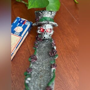 Guns and Roses style incense burner with incense.